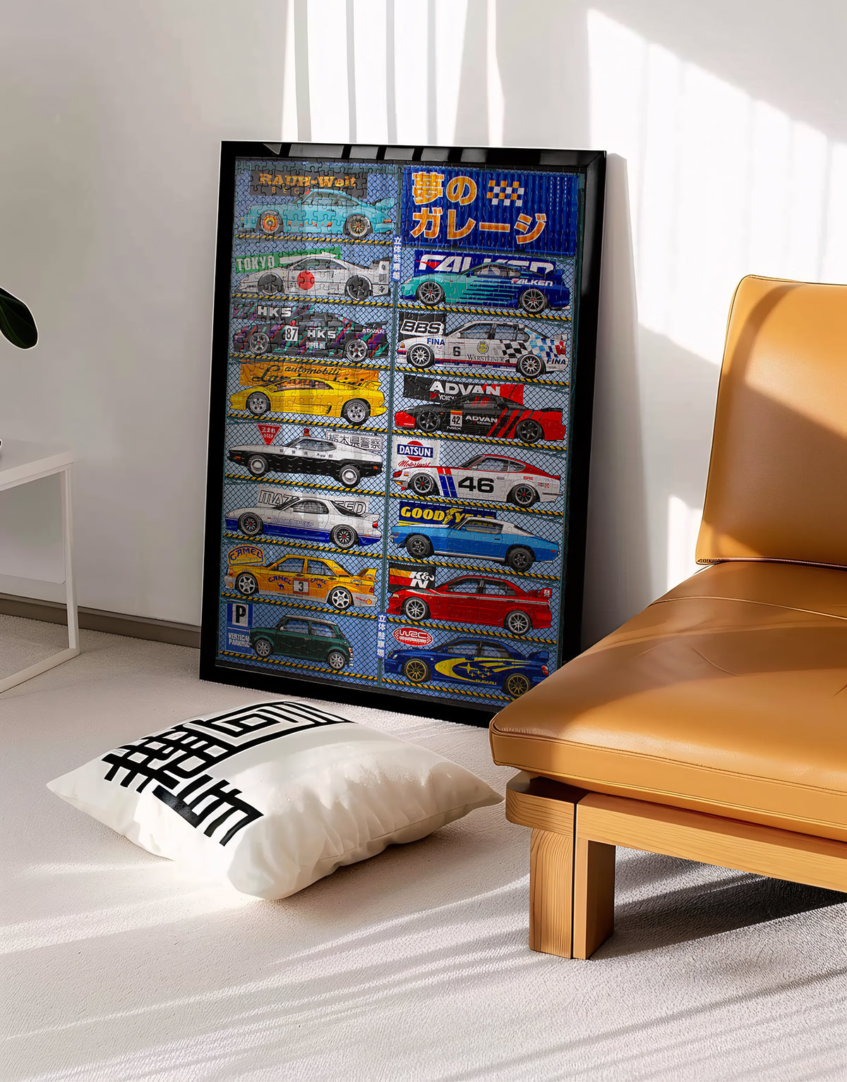 Framed poster with car illustrations on a wall next to a brown leather chair.