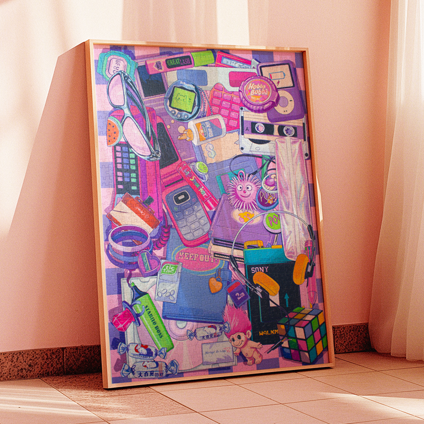 A large framed art print leaning against a peach-colored wall in a sunlit room. The print features a dense collage of colorful objects and figures in purple, pink, blue, green, and orange tones.