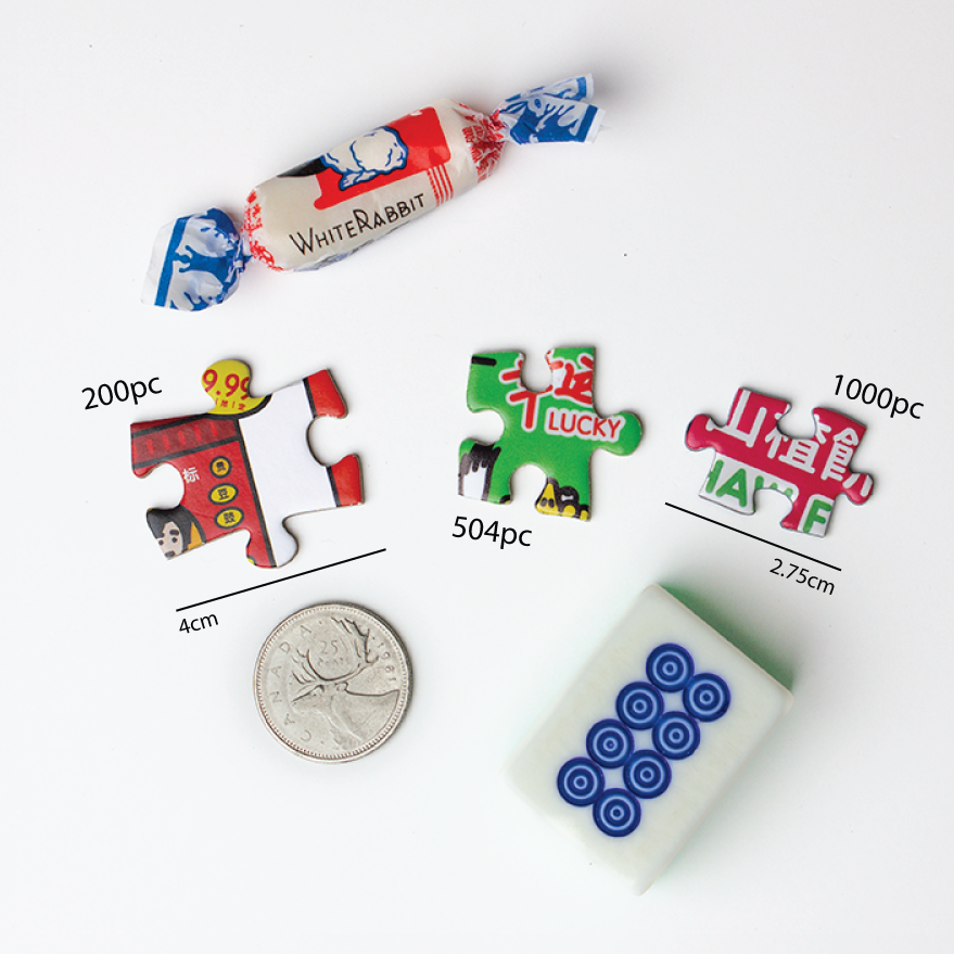 shown beside a white rabbit candy, a quarter & a mahjong tile.